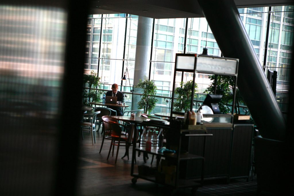 Office cafe with Thrings solicitor working on laptop
